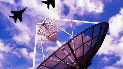 Military personnel operating RF communication devices